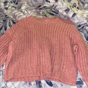 A long sleeve pink sweater